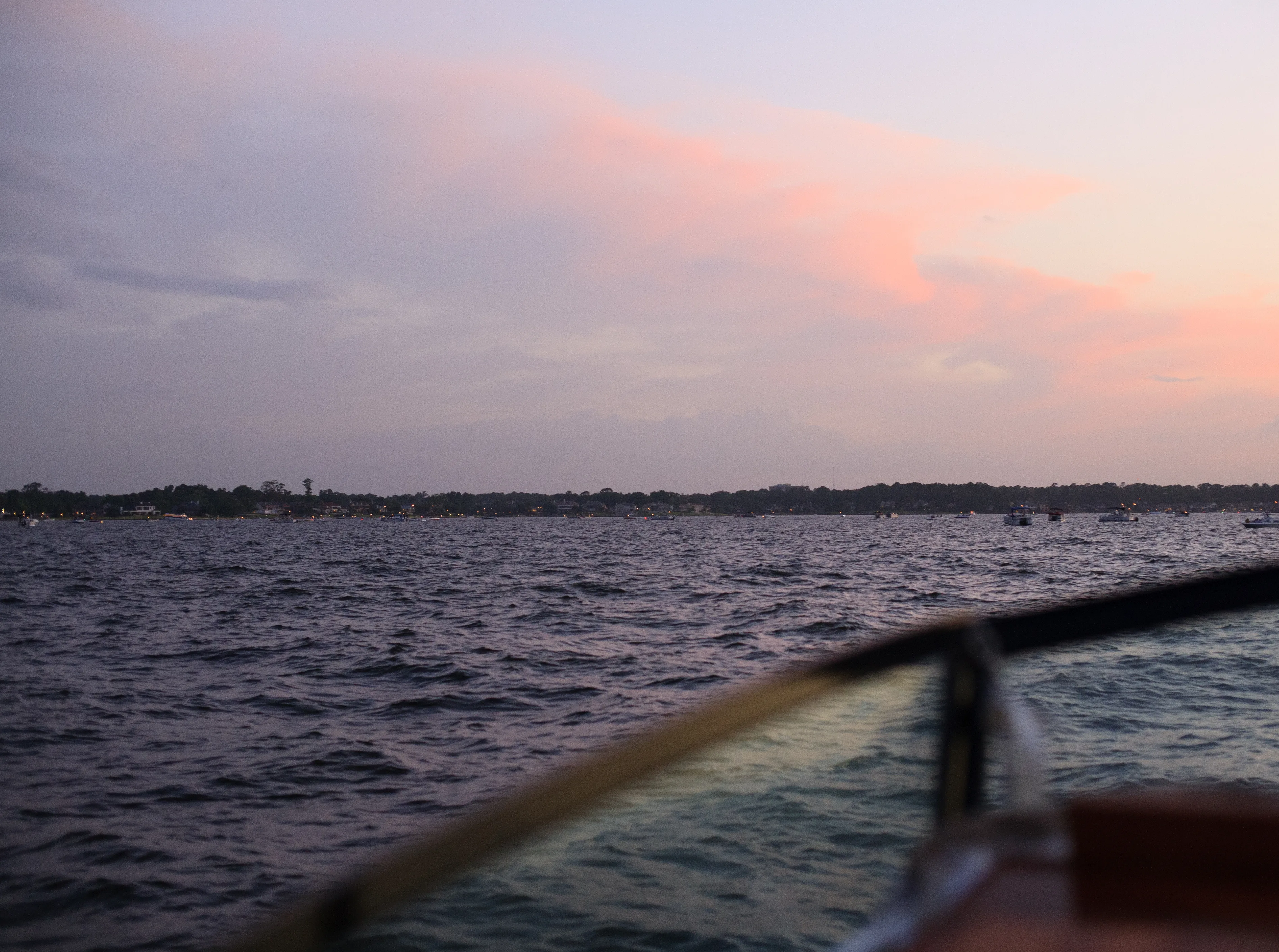 Beautiful sunset reflecting over Lake Conroe waterfront homes